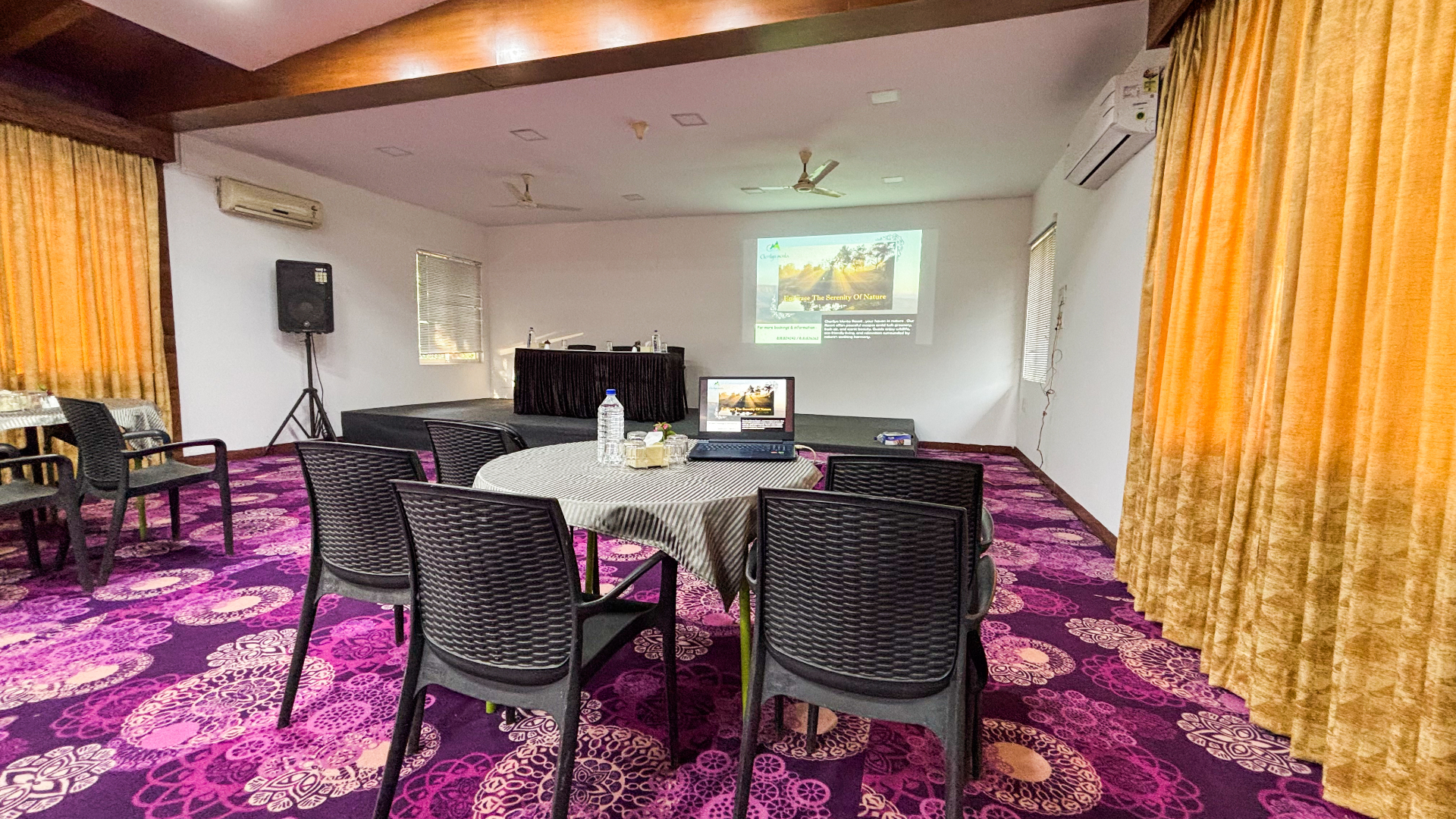 Conference hall with projector screen and stage