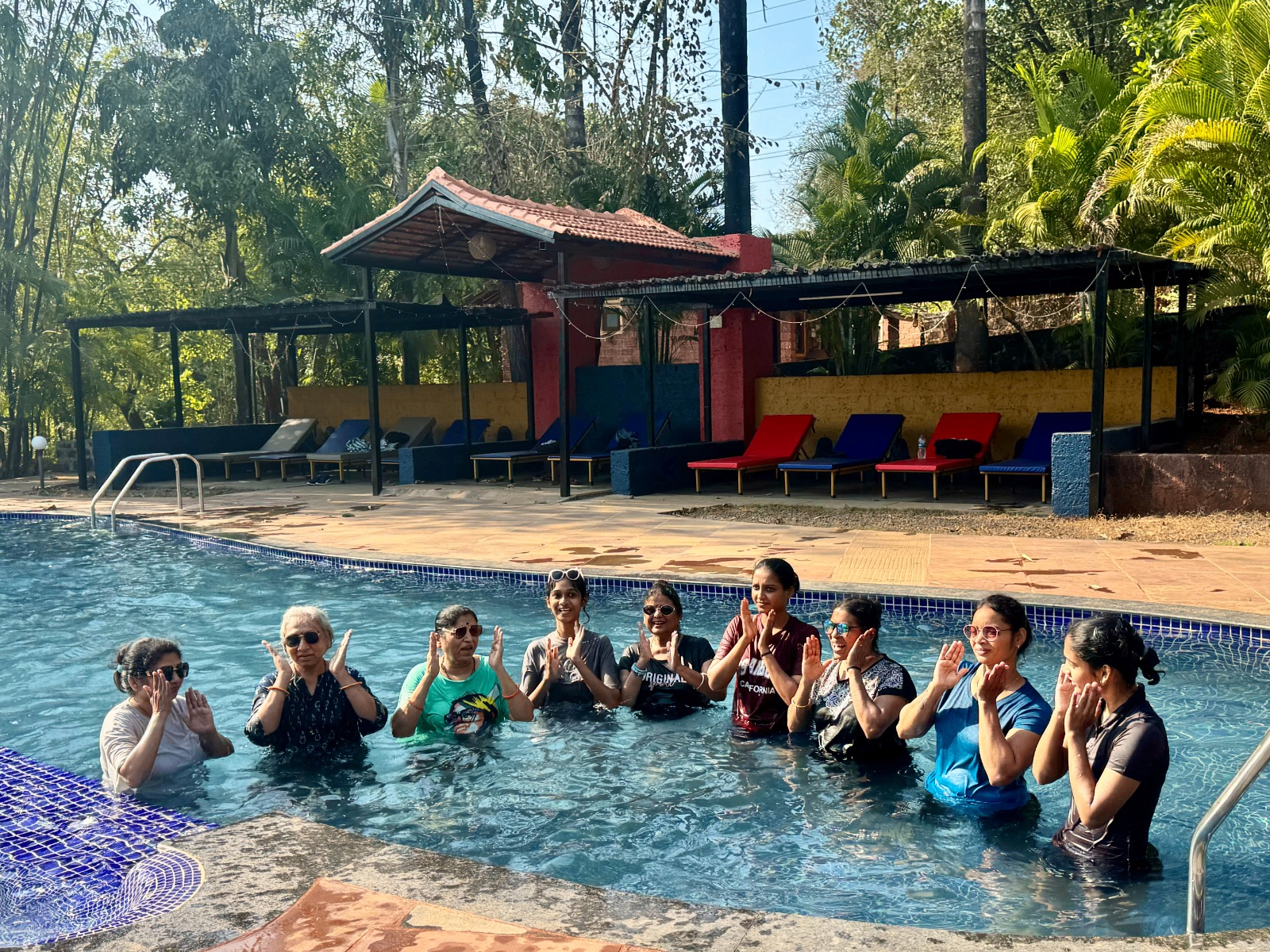 Group enjoying pool wellness session